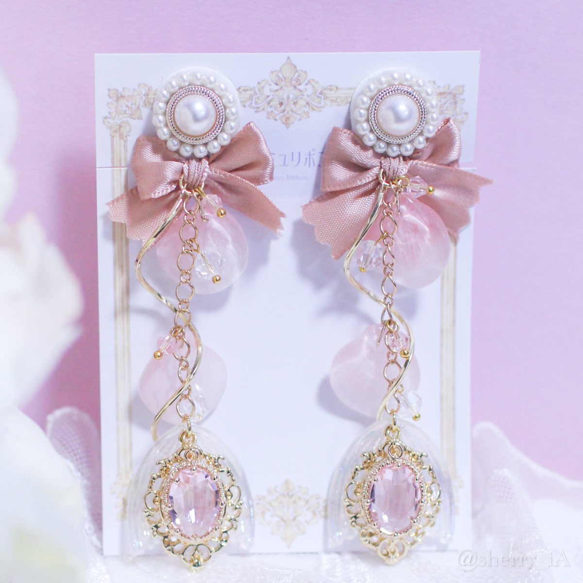 アミュリボン 澄み渡る春の煌めきとsakura mermaid 耳飾り 桜の花びらをイメージしたガラスのパーツとピンクのビジューを使って作った人魚姫のハンドメイドアクセサリー 桜色